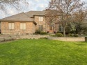 Custom built, full brick home in the prestigious gated and for sale in Lake In The Hills Illinois McHenry County County on GolfHomes.com