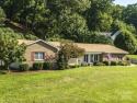 This Charming Home Sits On A Beautifully Landscaped 1+Acre Lot for sale in Waynesville North Carolina Haywood County County on GolfHomes.com