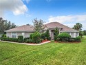 IN THE ESTATES OF BLACK BEAR RESERVE, A CHARMING HOME SITS ON for sale in Eustis Florida Lake County County on GolfHomes.com