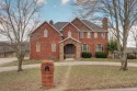 Welcome to your private Oasis! This all-brick home sits for sale in Clever Missouri Christian County County on GolfHomes.com