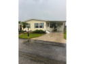 This exclusive listing is on leased land with a monthly lot rent for sale in Auburndale Florida Polk County County on GolfHomes.com