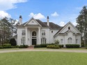 Experience resort-style living year-round at this elegant and for sale in Johns Creek Georgia Fulton County County on GolfHomes.com