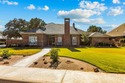 FANTASTIC LOCATION WITH SWEEPING GOLF COURSE VIEWS--NORTH GREEN for sale in Midland Texas Midland County County on GolfHomes.com