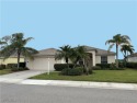 Popular Ibis II open floorplan home with a POOL and a LAKE and for sale in North Fort Myers Florida Lee County County on GolfHomes.com