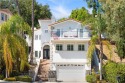 This modern hillside residence in Woodland Hills offers 4 for sale in Woodland Hills California Los Angeles County County on GolfHomes.com