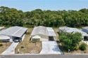 Pride of ownership shows in this move-in ready home. This for sale in Barefoot Bay Florida Brevard County County on GolfHomes.com