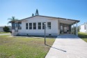 This home sits on a corner lot near our 18-hole golf course. It for sale in Barefoot Bay Florida Brevard County County on GolfHomes.com
