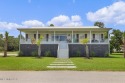 Welcome to 129 Sweet Bay Dr., a stunning coastal retreat nestled for sale in Pass Christian Mississippi Harrison County County on GolfHomes.com