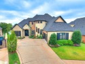 Located in the prestigious gated community of Rose Creek, this for sale in Edmond Oklahoma Oklahoma County County on GolfHomes.com