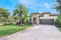 Set on an oversized lot at the end of a cul-de-sac in Greyhawk for sale in Naples Florida Collier County County on GolfHomes.com