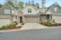 Indulge in high-end luxury living with this exquisite townhome for sale in Canton Georgia Cherokee County County on GolfHomes.com