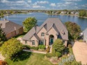 Welcome to your lakefront dream in The Shores of Waterstone, a for sale in Oxford Michigan Oakland County County on GolfHomes.com