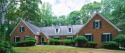 This fully-renovated brick home on an over an acre estate lot for sale in Snellville Georgia Gwinnett County County on GolfHomes.com