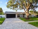 Experience waterfront luxury living in this fully renovated for sale in Valrico Florida Hillsborough County County on GolfHomes.com