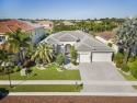 This stunning, luxurious single-story residence offers soaring for sale in Boca Raton Florida Palm Beach County County on GolfHomes.com