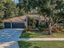 Exquisite Luxury Retreat in East Lake Woodlands. Nestled on an for sale in Oldsmar Florida Pinellas County County on GolfHomes.com