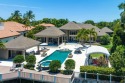Indulge in waterfront luxury at this French-inspired masterpiece for sale in Jupiter Florida Palm Beach County County on GolfHomes.com