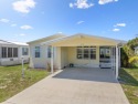 This 2004 2-bed, 2-bath split-plan home is nestled on a quiet for sale in Barefoot Bay Florida Brevard County County on GolfHomes.com