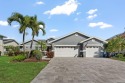 Discover luxury coastal living at its finest in this fully for sale in Apollo Beach Florida Hillsborough County County on GolfHomes.com
