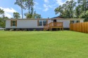 Step inside this beautifully reimagined manufactured home for sale in Tallahassee Florida Leon County County on GolfHomes.com