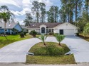 18 ft wide Circular driveway, CHECK!! Enclosed 354 sq. ft. lanai for sale in Palm Coast Florida Flagler County County on GolfHomes.com