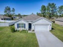 Welcome to this beautifully crafted, nearly brand-new home for sale in Ocala Florida Marion County County on GolfHomes.com