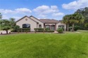 Step into the essence of luxury with this stunning custom-built for sale in Summerfield Florida Marion County County on GolfHomes.com