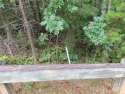 Private .97 acre lot with a stream in the highly desirable gated for sale in Mill Spring North Carolina Polk County County on GolfHomes.com