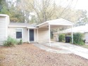 LOVELY Occupied SE Duplex w/ Carports, Fenced Yards, & Storage for sale in Tallahassee Florida Leon County County on GolfHomes.com