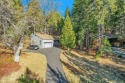 Nestled among majestic redwood trees in the prestigious Forest for sale in Murphys California Calaveras County County on GolfHomes.com