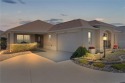 This BETTER-THAN-NEW, UPSCALE home is one of the LARGEST and for sale in The Villages Florida Lake County County on GolfHomes.com