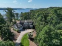 Experience lakefront living at its finest in this stunning for sale in New London North Carolina Montgomery County County on GolfHomes.com