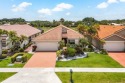 Located in the highly sought-after Boca Woods Country Club, this for sale in Boca Raton Florida Palm Beach County County on GolfHomes.com