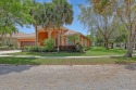 Welcome to this charming one-story home in Madison Green, Royal for sale in Royal Palm Beach Florida Palm Beach County County on GolfHomes.com