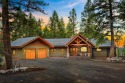 Nestled at the end of a tranquil road, this custom masterpiece for sale in Bigfork Montana Flathead County County on GolfHomes.com
