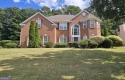 Welcome to this spacious 4-bedroom, 2.5-bath home perfectly for sale in Covington Georgia Newton County County on GolfHomes.com