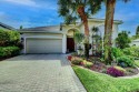 Welcome home to Woodfield Country Club! Situated on a corner lot for sale in Boca Raton Florida Palm Beach County County on GolfHomes.com