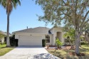 The charming three-bedroom ranch offers the epitome of relaxed for sale in Bradenton Florida Manatee County County on GolfHomes.com
