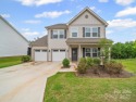 Nestled on a serene cul-de-sac lot with a picturesque pond view for sale in Lancaster South Carolina Lancaster County County on GolfHomes.com