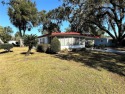 2/2 double-wide with a huge family room, enclosed porch and for sale in Wildwood Florida Sumter County County on GolfHomes.com