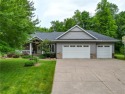 Beautifully maintained home sits on a spacious .69-acre lot for sale in Menomonie Wisconsin Dunn County County on GolfHomes.com