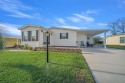 Welcome to this beautifully maintained 2-bedroom, 2-bathroom for sale in Lady Lake Florida Lake County County on GolfHomes.com