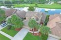 This stunning lakefront country club residence is the perfect for sale in Boynton Beach Florida Palm Beach County County on GolfHomes.com