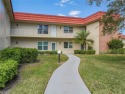 THIS MUST BE THE PLACE! Opportunity knocks at this top floor for sale in Vero Beach Florida Indian River County County on GolfHomes.com