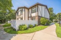 Two-story end-unit Condo Located in this highly desirable GATED for sale in Medford New York Suffolk County County on GolfHomes.com
