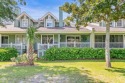 Unwind on your screened porch with front-row views of Davis for sale in Fripp Island South Carolina Beaufort County County on GolfHomes.com