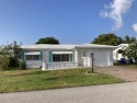 This charming 2 bed, 2 bath, 1400 sqft  home is nestled on a for sale in Pompano Beach Florida Broward County County on GolfHomes.com