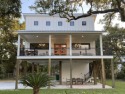 Just listed this fresh modern mid-century design home that for sale in Bay Saint Louis Mississippi Hancock County County on GolfHomes.com