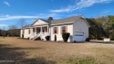 Ranch style three bedroom, two bath home on over an acre with for sale in Beaufort North Carolina Carteret County County on GolfHomes.com