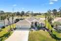 An absolutely stunning home on The Golf Course with Golf Cart for sale in Lady Lake Florida Sumter County County on GolfHomes.com